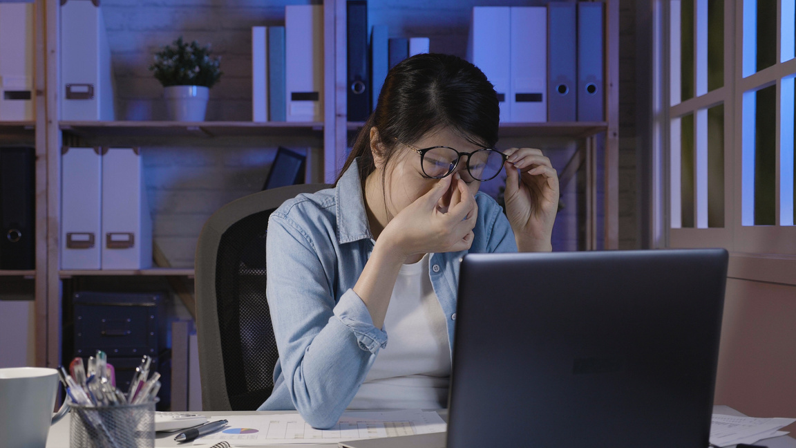 soho lady stay up late in home office eye painful
